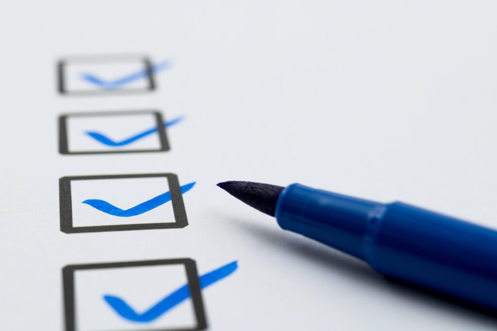 Blue pen marking on checklist sheet
